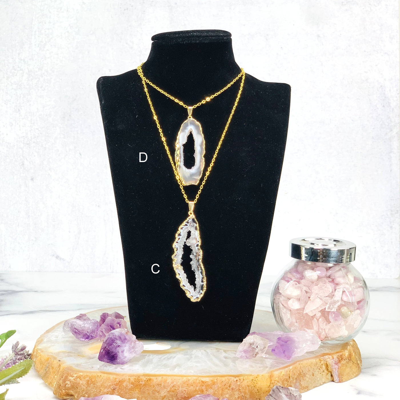 Display of 2 Agate Druzy Slice Pendant with Electroplated Gold Edge with chain on mannequin