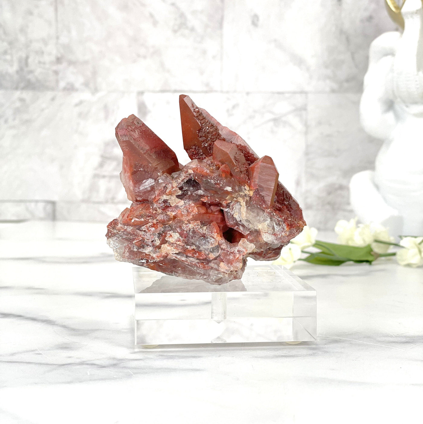 A backside of the Red Hematite Quartz on acrylic stand