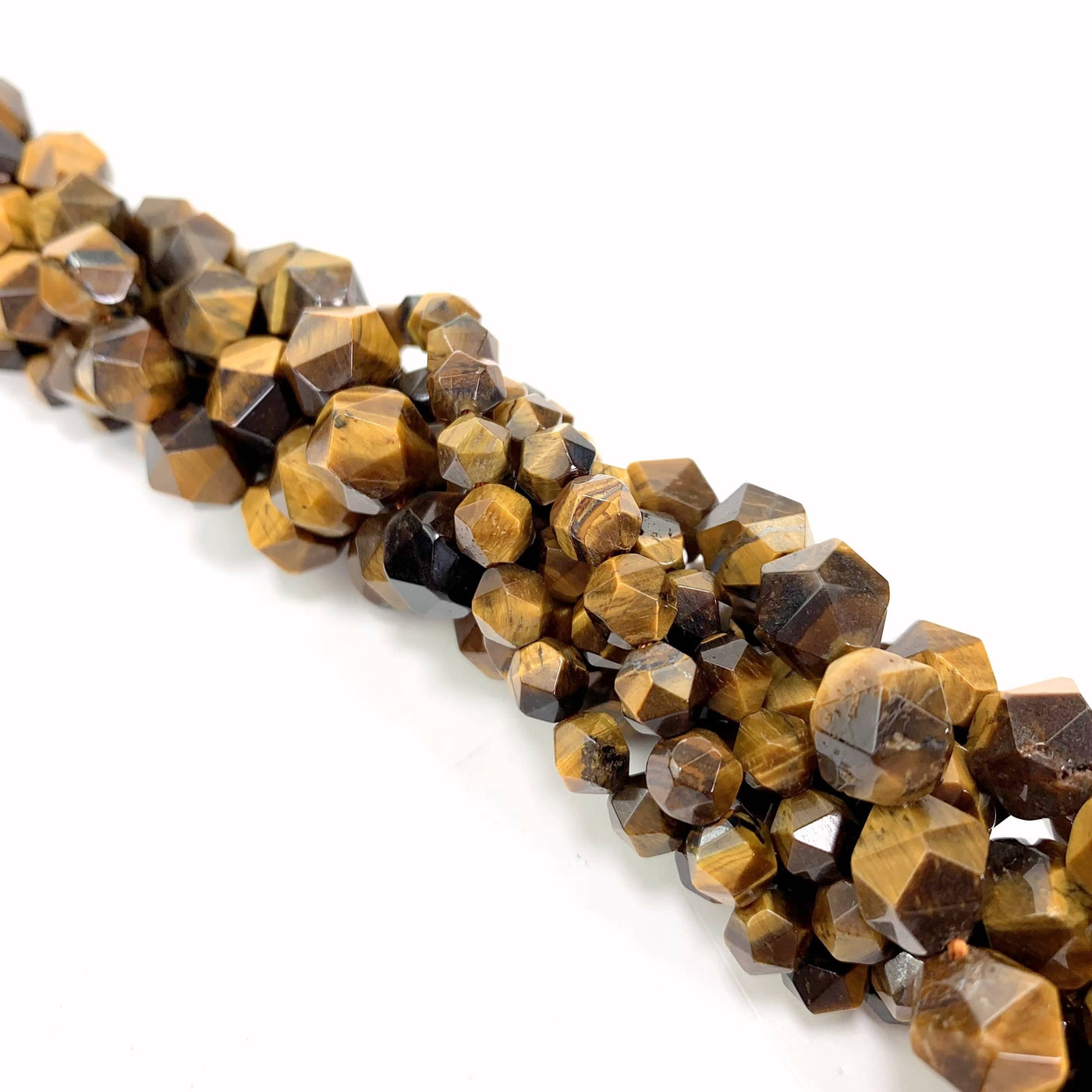 Faceted Pentadecagon Tiger Eye Beads twisted together on a white background