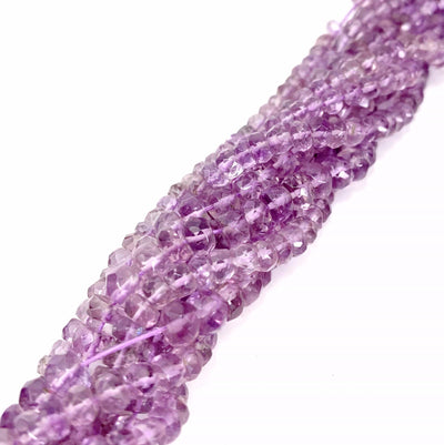 amethyst beads twisted together on a white background