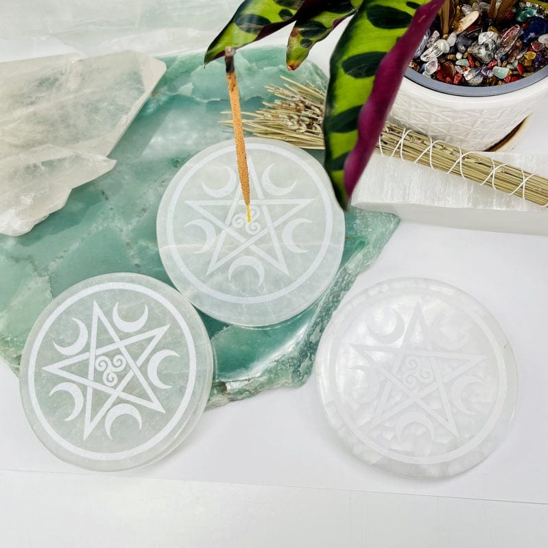 selenite incense holder with pentacle set up as home decor 