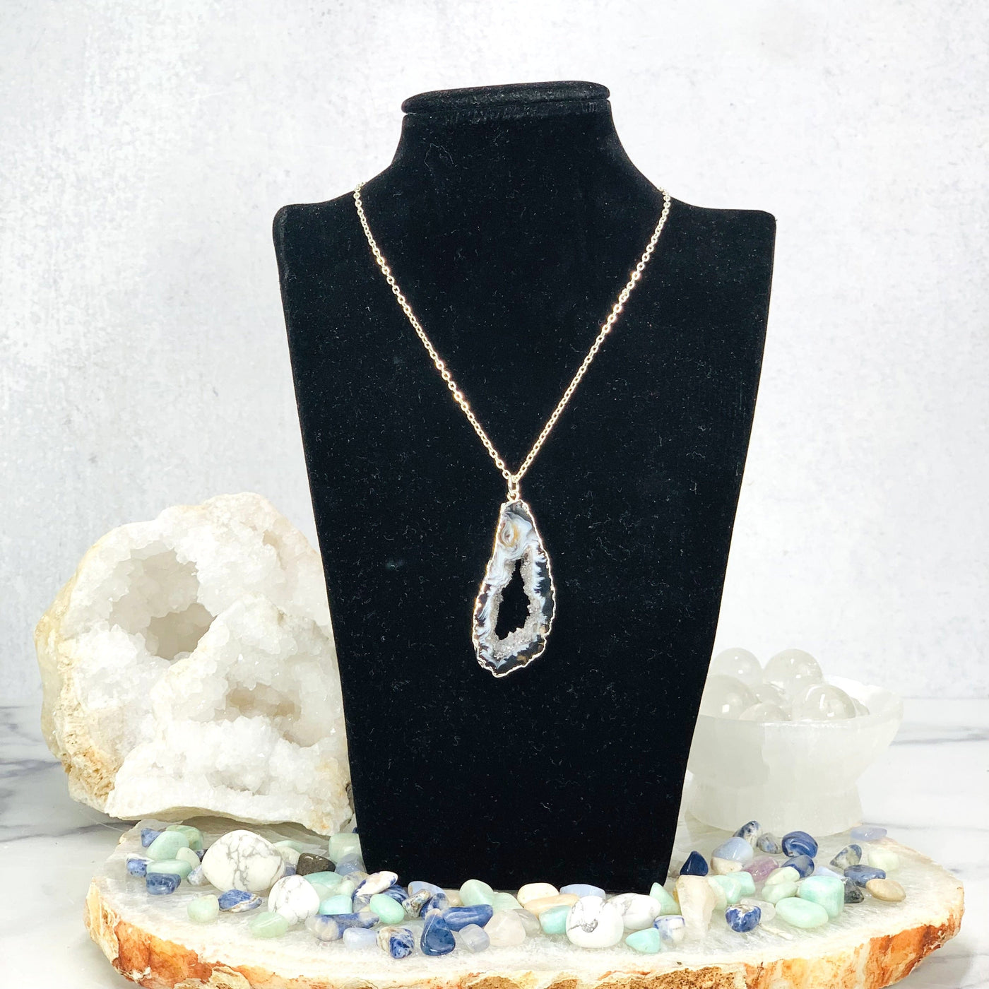 Agate Druzy Slice Pendant with Electroplated Silver Edge displayed  on mannequin 