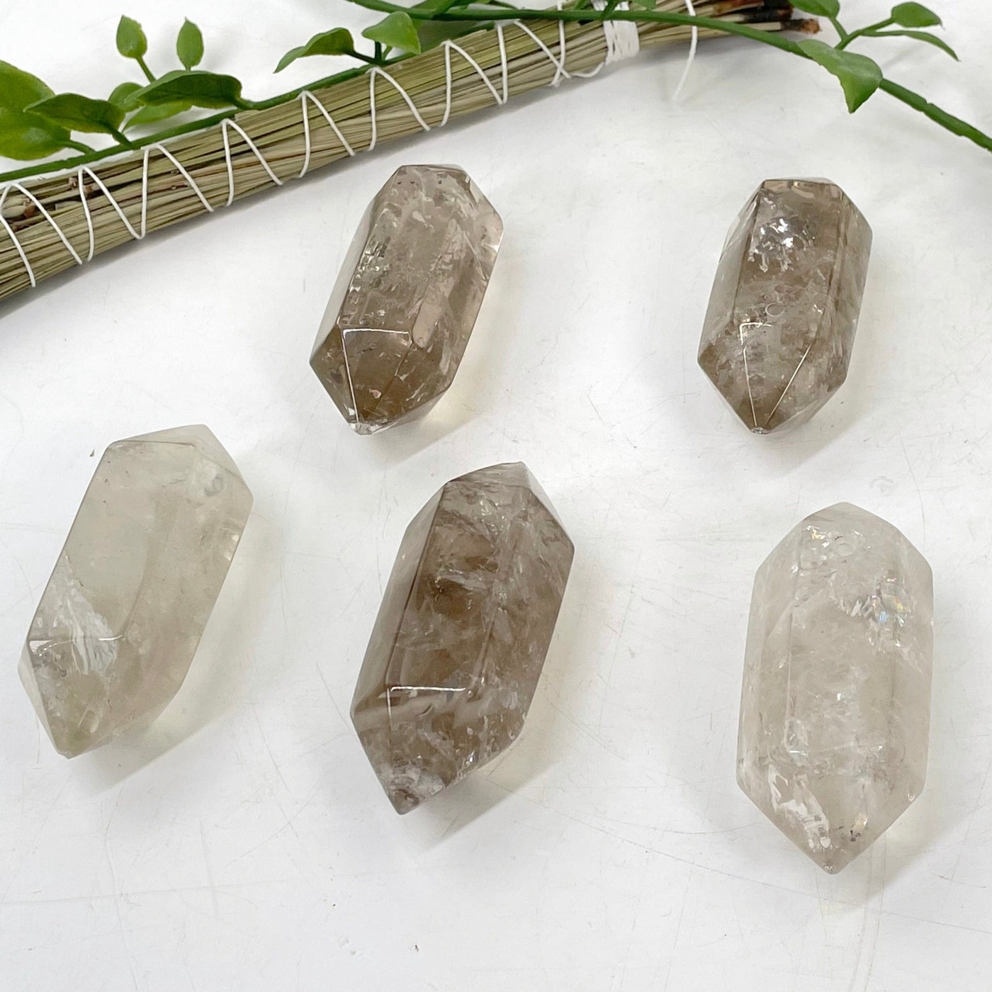 smoky quartz double terminated points laying on a table