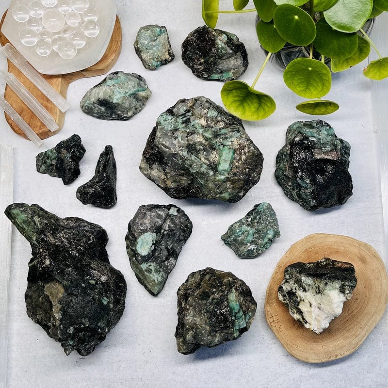 raw natural emerald clusters displayed to show the differences in the stone sizes 