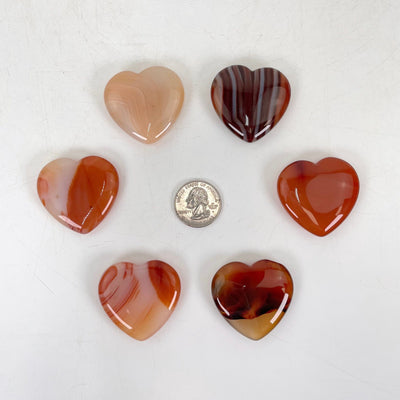 carnelion polished hearts with quarter for size reference