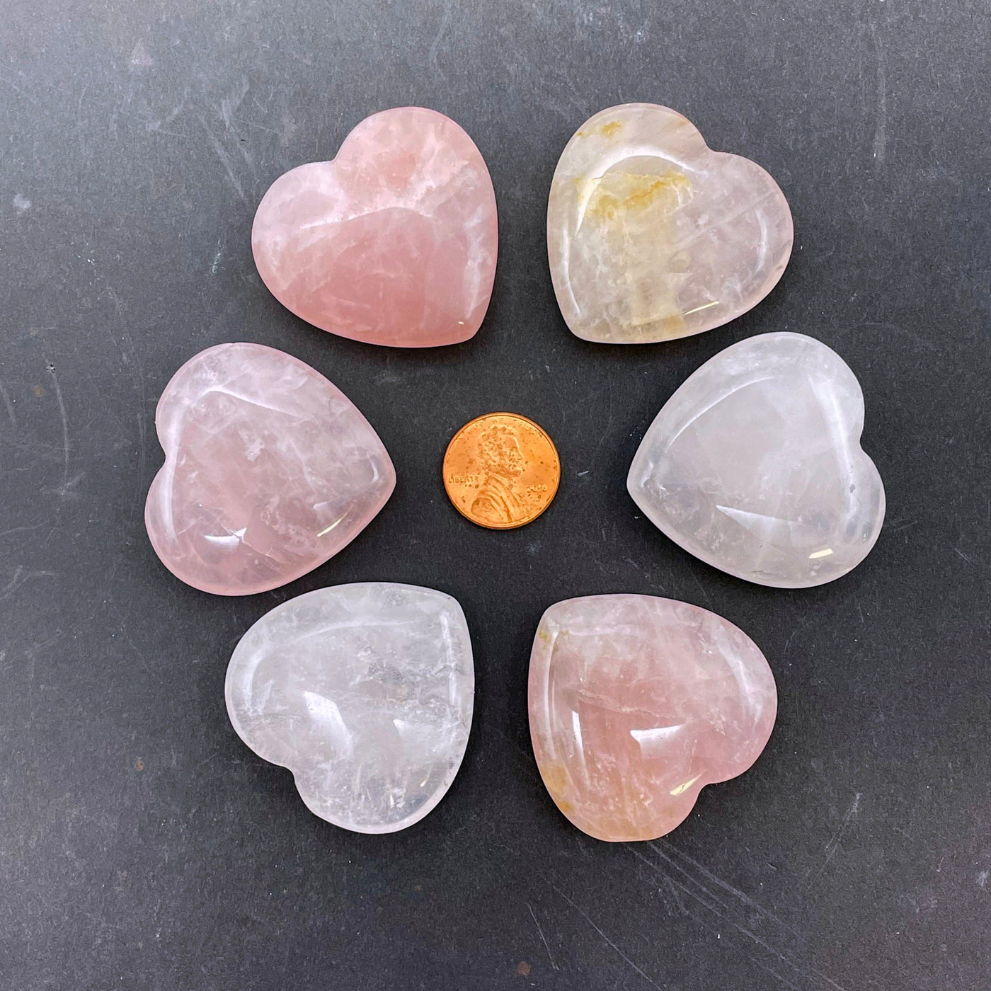 rose quartz polished hearts with penny for size reference