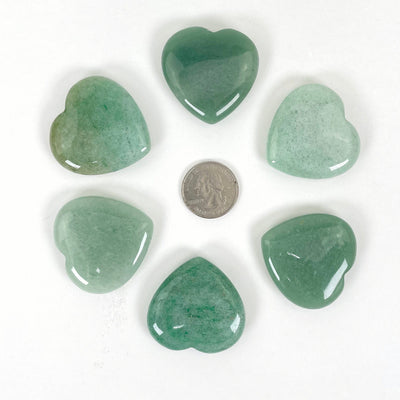 green aventurine polished hearts with quarter for size reference