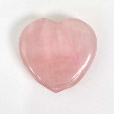 close up of chipped rose quartz polished heart for possible damages