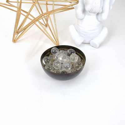 crystal quartz spheres in bowl in front of backdrop (bowl not included with purchase)