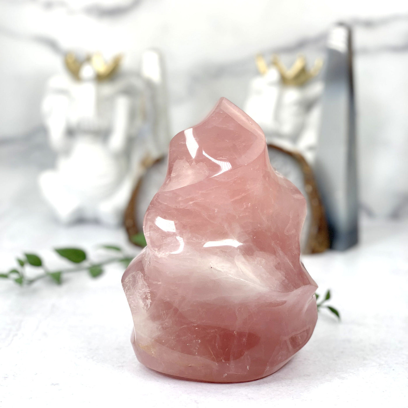 A vibrant Pink Rose Quartz Flame Tower on white background
