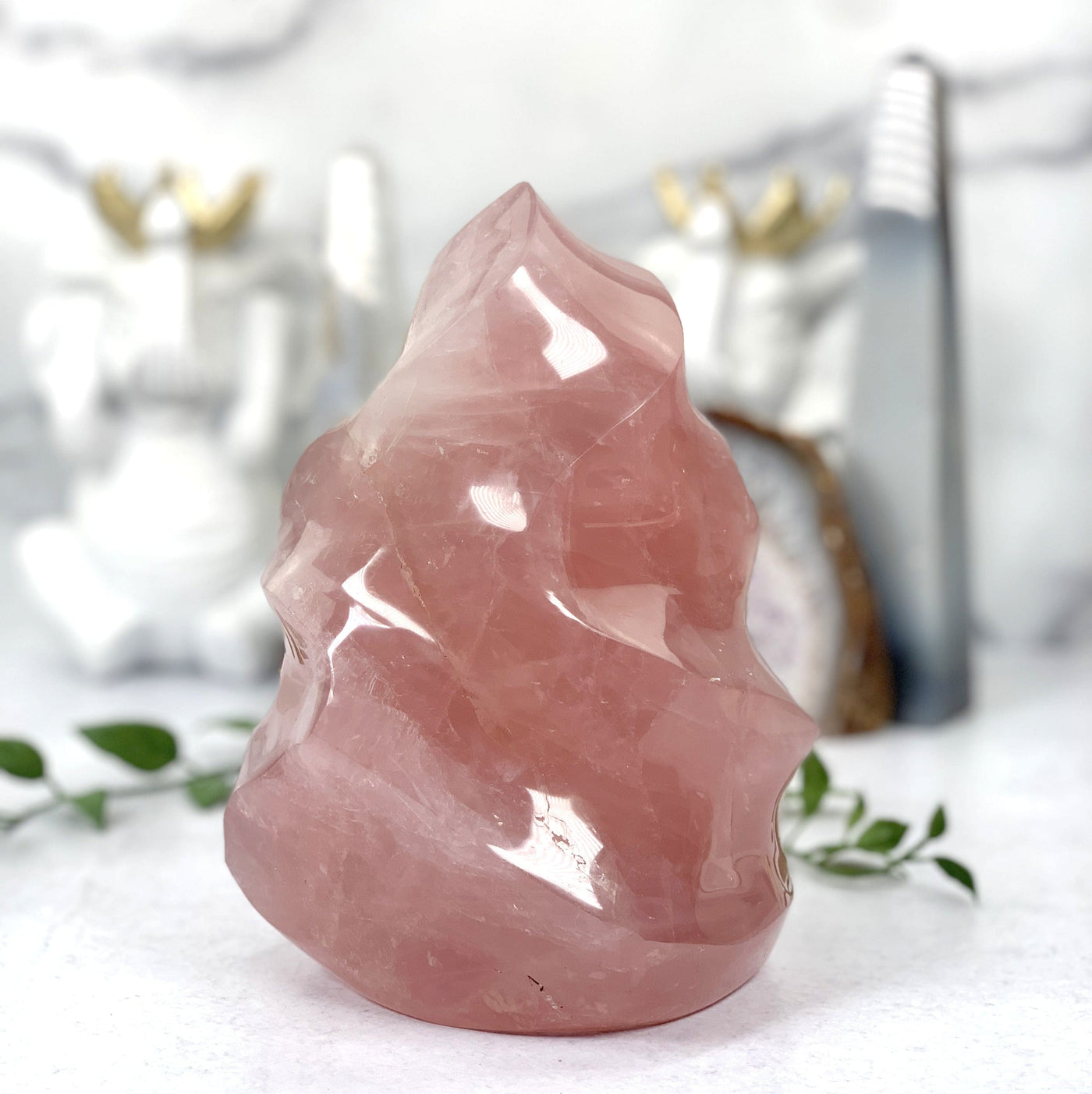 Pink Rose Quartz Flame Tower on white background