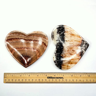 heart bowl next to a ruler for size reference 