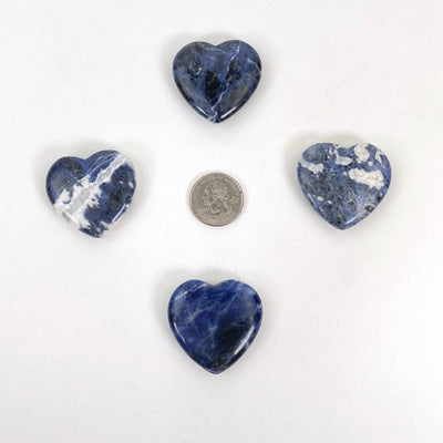 sodalite polished hearts with quarter for size reference