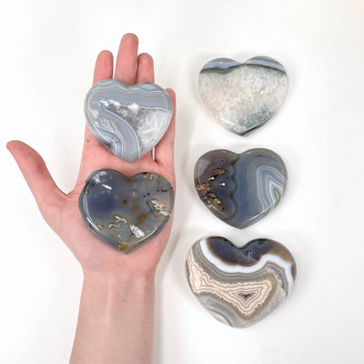 all natural agate druzy heart options with hand for size reference