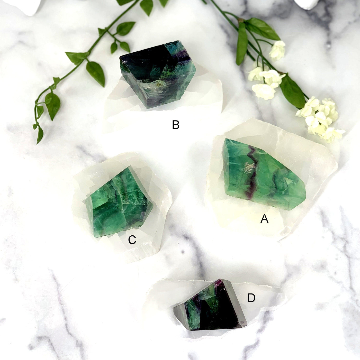 4 beautiful Fluorite Chunks spread out on white background