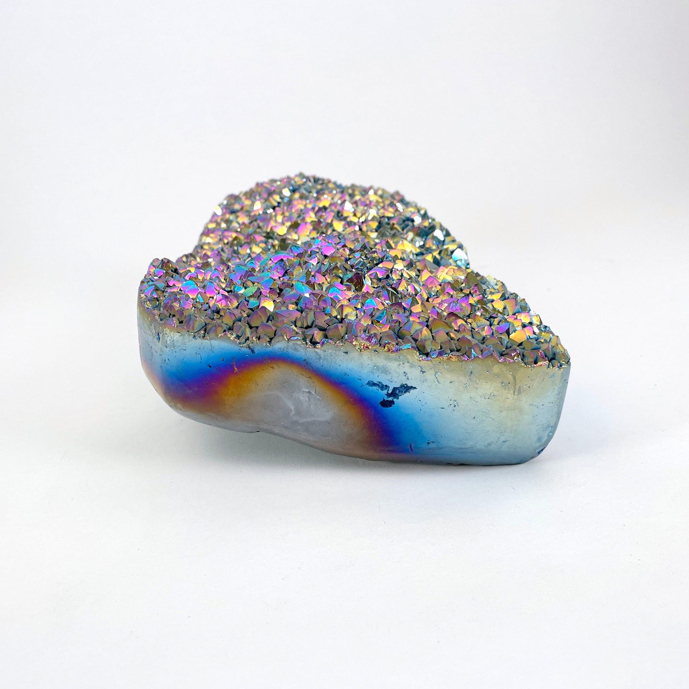 side view of rainbow titanium druzy stone laying flat for thickness