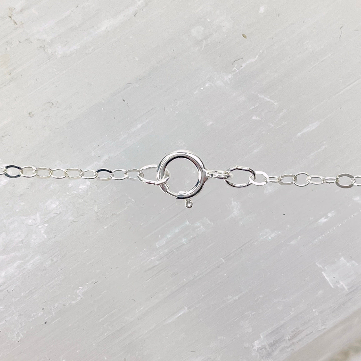 close up of silver electroplated chain and clasp