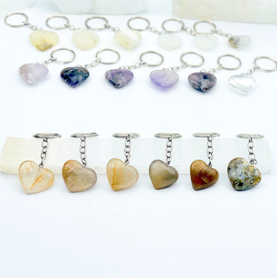 yellow quartz heart keychain displayed to show variations in color and size
