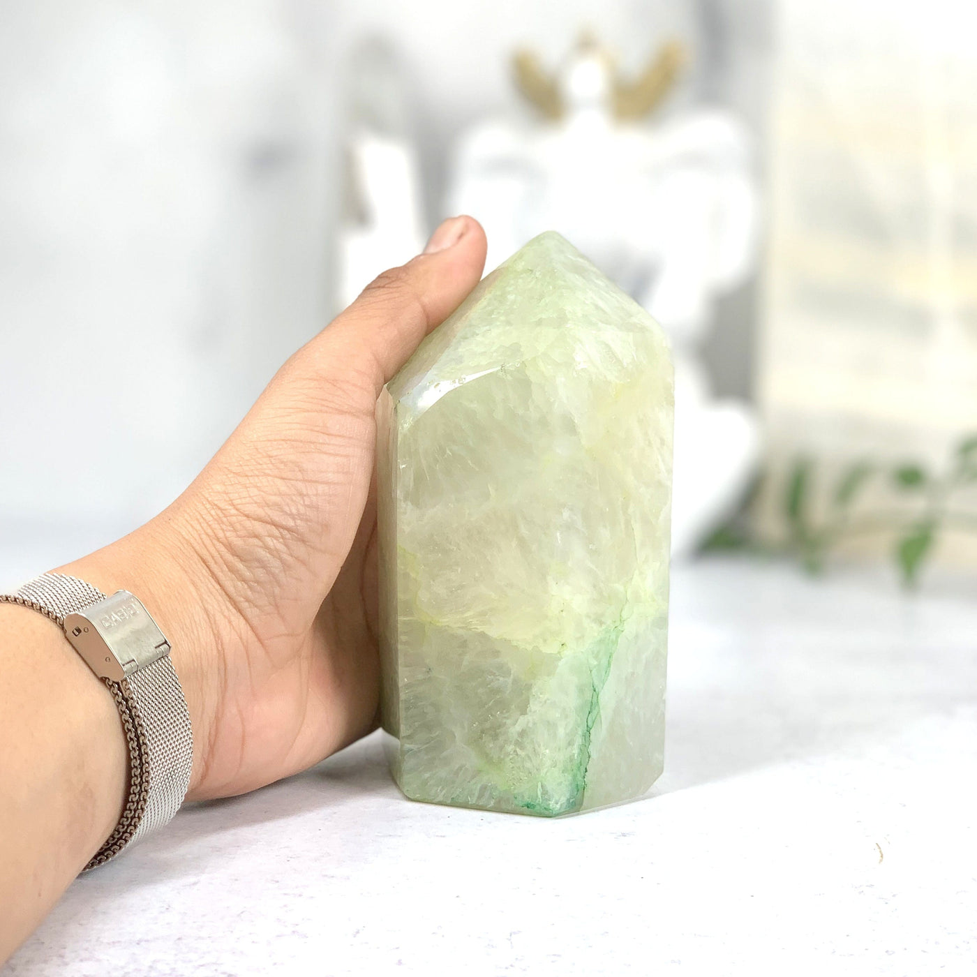 Hand holding the side angle of the  Dyed Green Agate Point