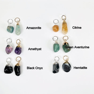 tumbled stones shown in gold and silver next to their stone names. available in amazonite, amethyst, black onyx, citrine, green aventurine, and hematite 