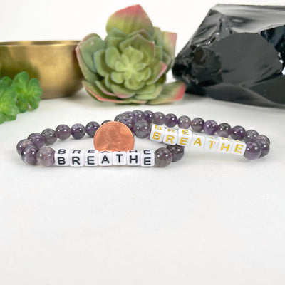 amethyst beaded bracelets with penny for size reference