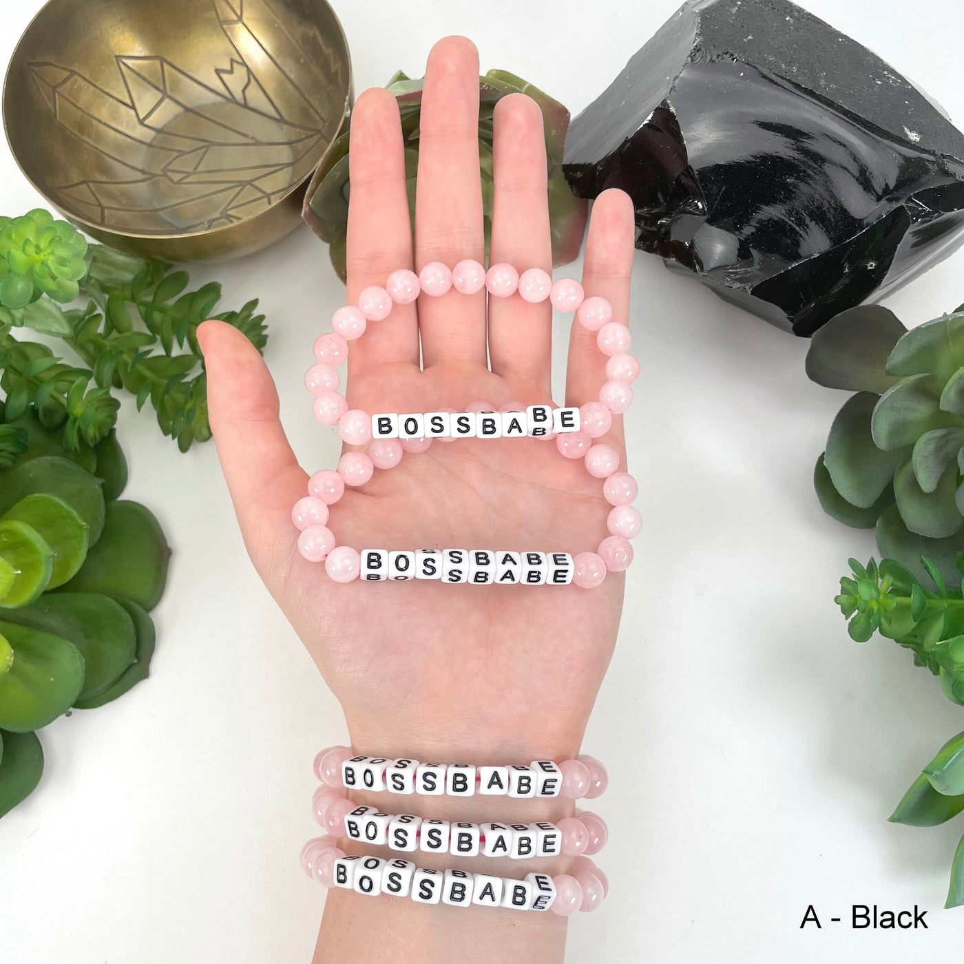 black "BOSSBABE" letter bead option in hand and on wrist for color reference