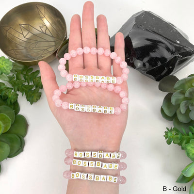 gold "BOSSBABE" letter bead option in hand and on wrist for color reference