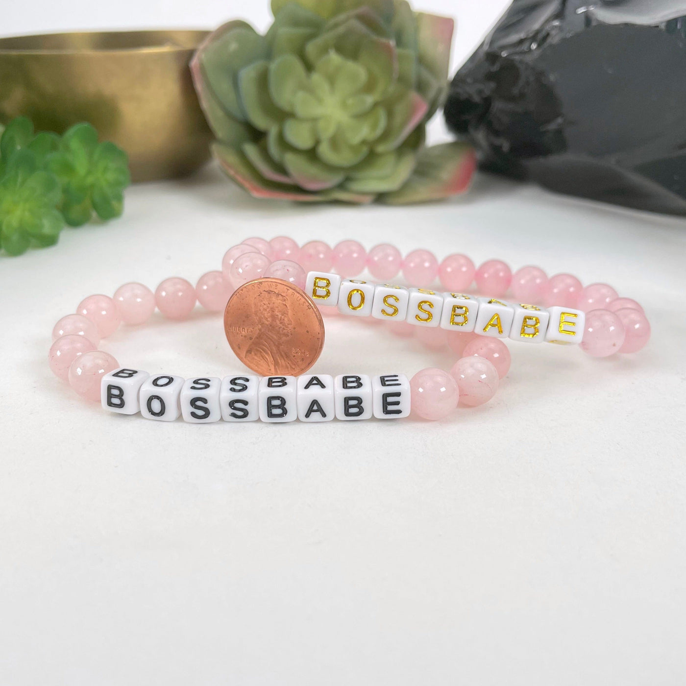 rose quartz beaded bracelets with penny for size reference
