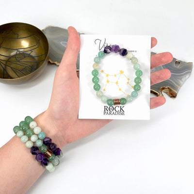 packaged virgo zodiac bracelet in hand with virgo zodiac bracelets on wrist