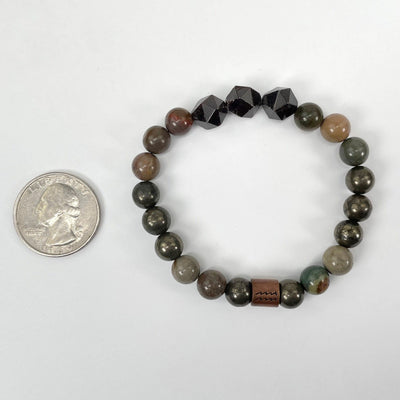 aquarius zodiac bracelet with quarter for size reference