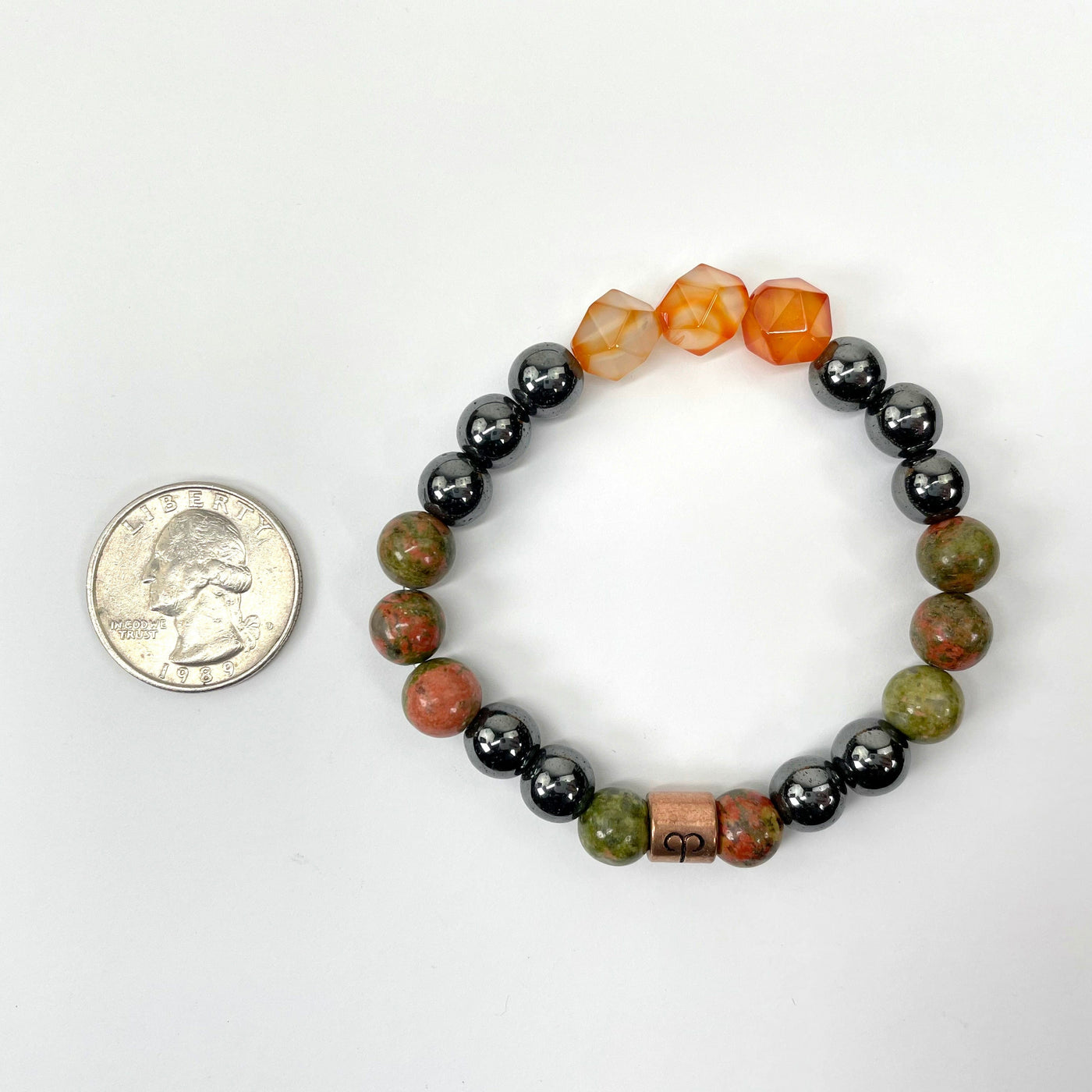 aries zodiac bracelet with quarter for size reference