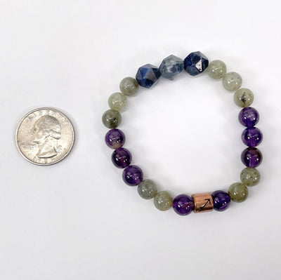 sagittarius zodiac bracelet with quarter for size reference
