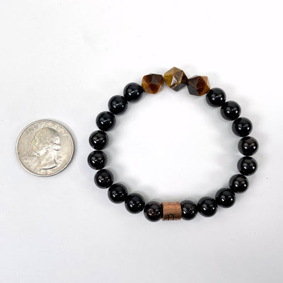 capricorn zodiac bracelet with quarter for size reference
