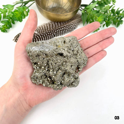 rough pyrite stone option 03 in hand for size reference