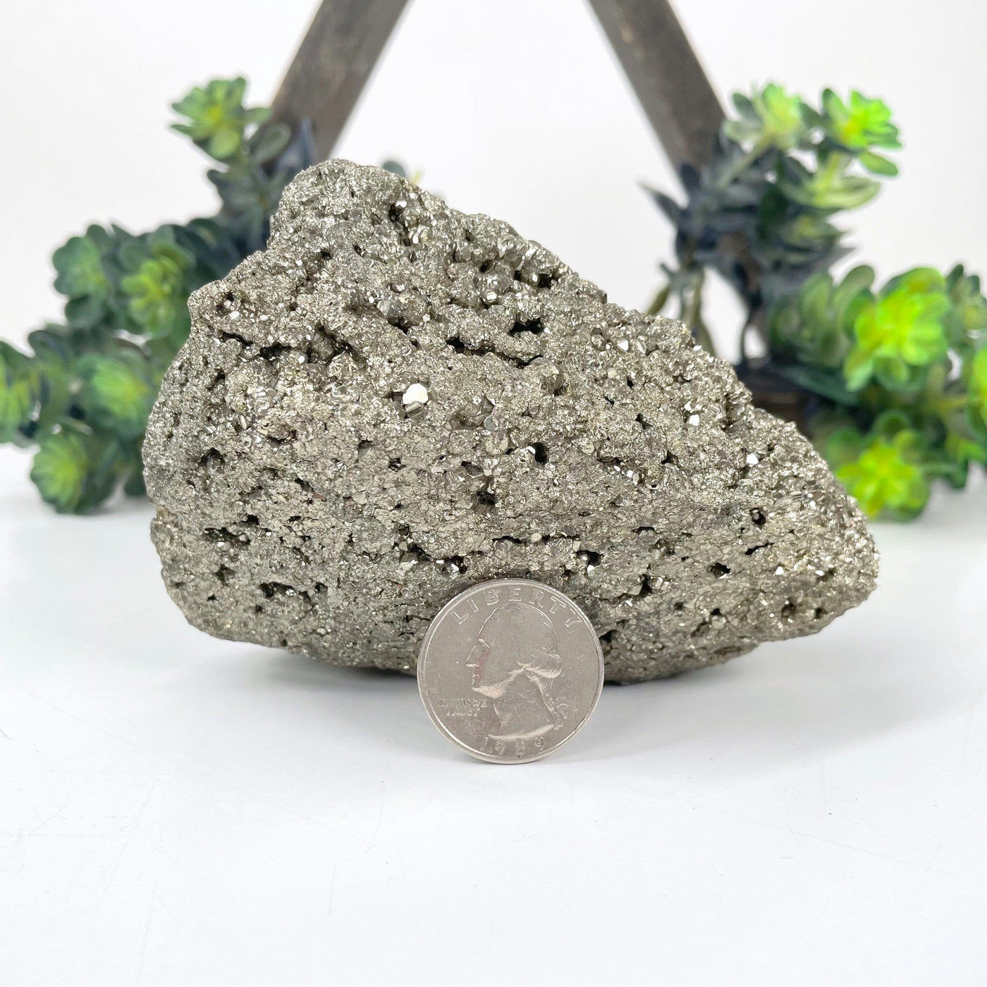 rough pyrite stone with quarter for thickness
