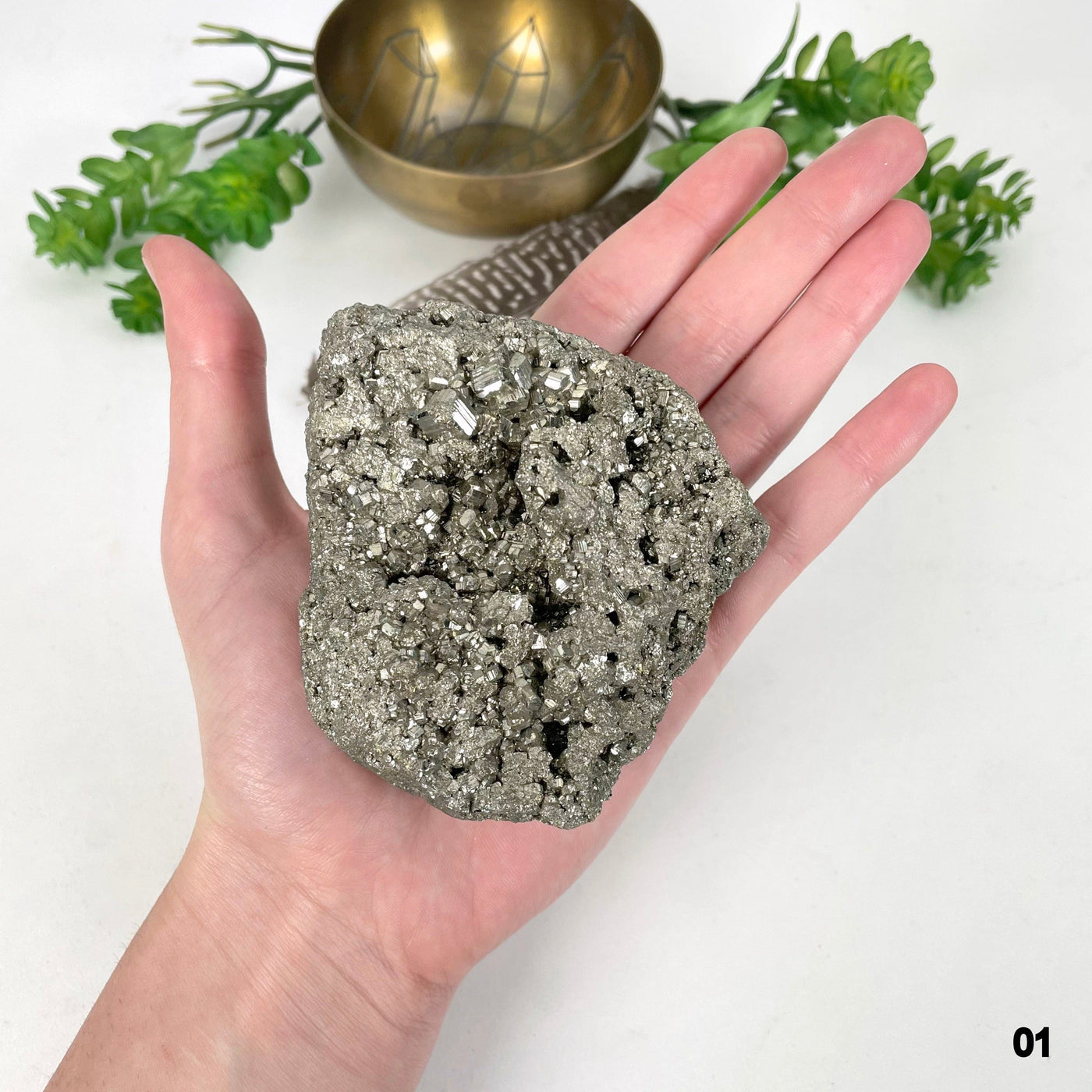 rough pyrite stone option 01 in hand for size reference