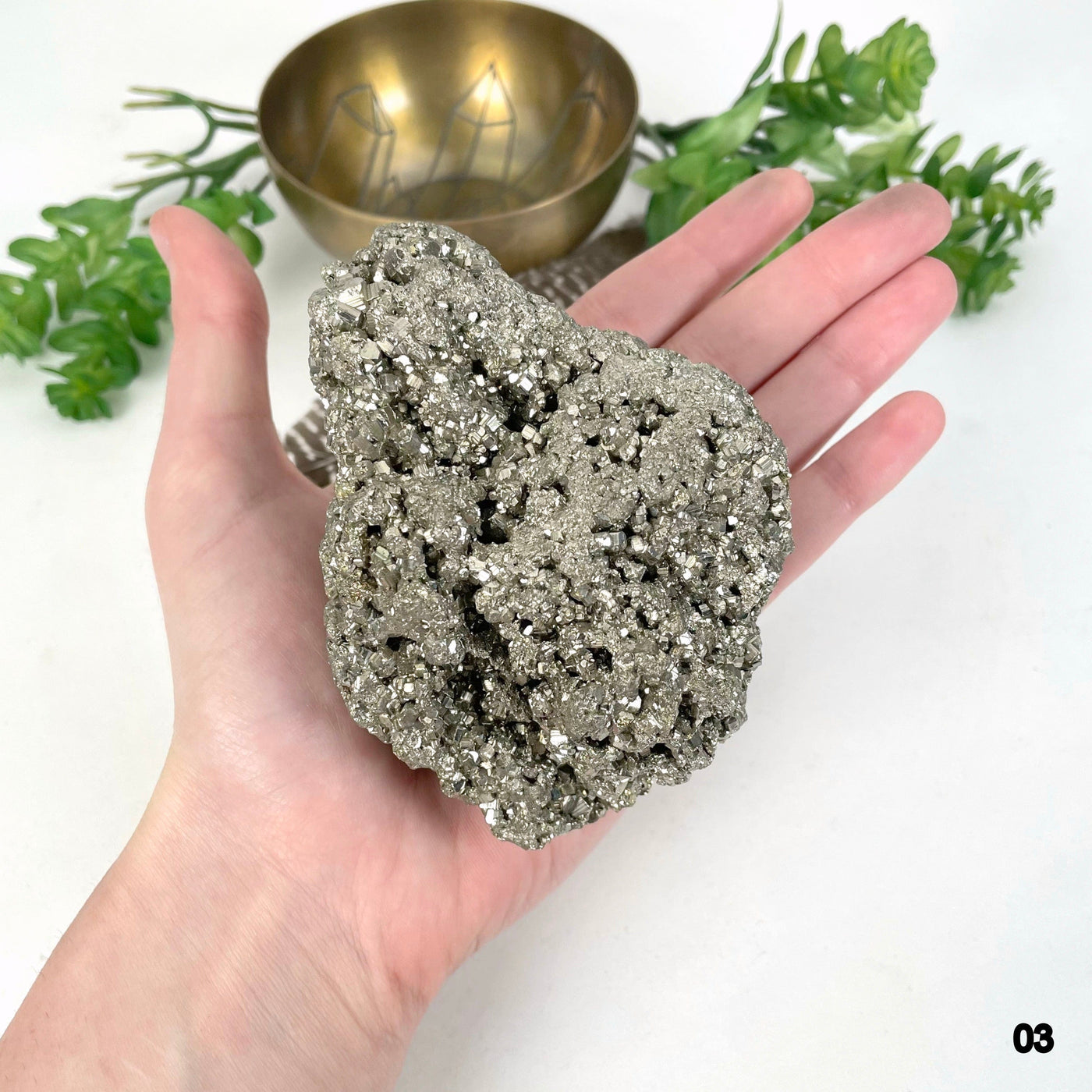 rough pyrite stone option 03 in hand for size reference