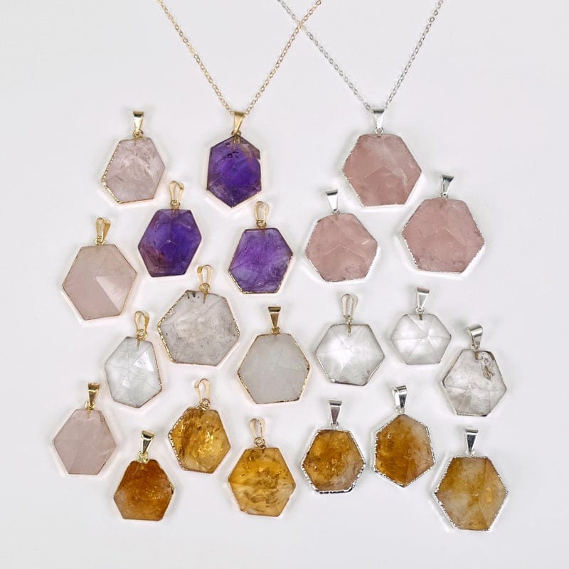 multiple hexagon point pendants displayed to show the differences in the colors and sizes 