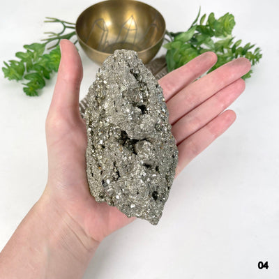 rough pyrite stone option 04 in hand for size reference