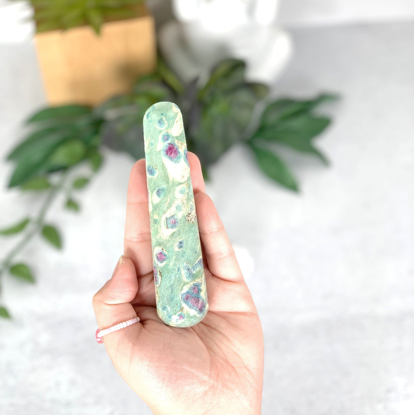 Ruby Fuchsite Massage Wand on hand