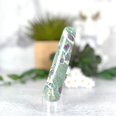 Ruby Fuchsite Massage Wand on acrylic stand