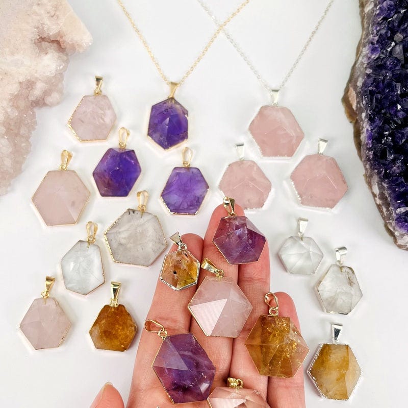 hexagon point pendants in hand for size reference 