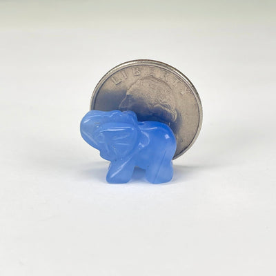 close up of gemstone elephant with quarter for size reference