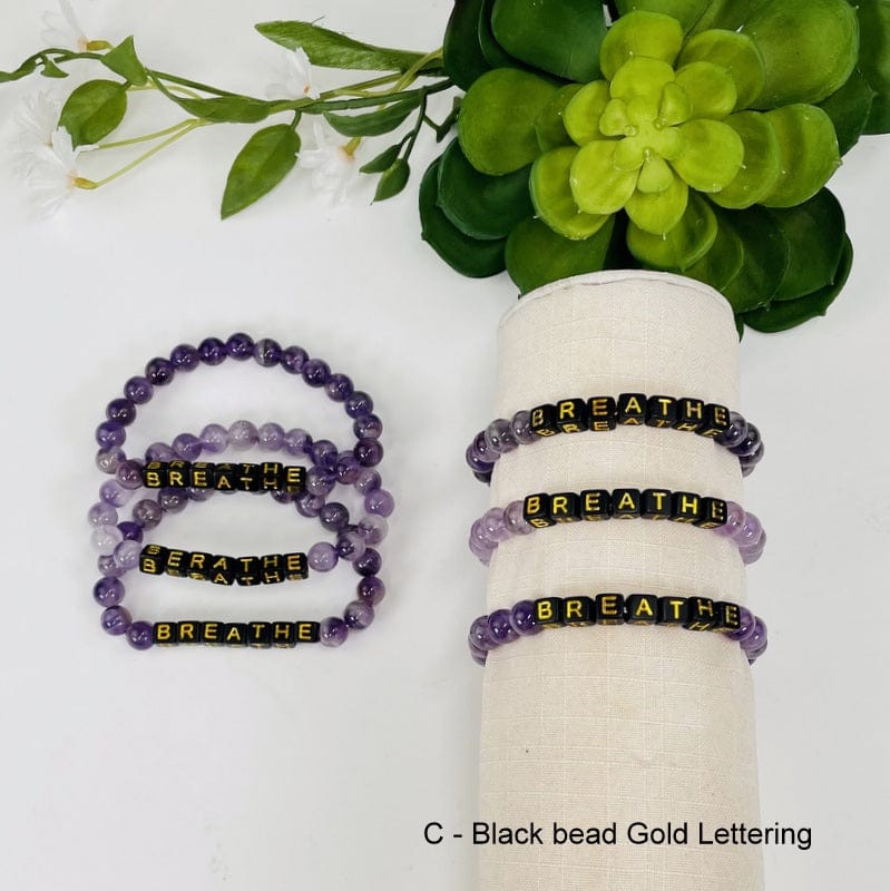 amethyst bracelet available with black beads and gold lettering