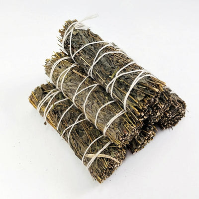 6 mugwort smudge bundle in a pile on white background