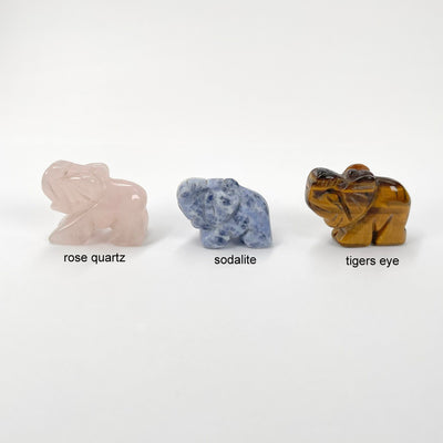 close up of rose quartz, sodalite, and tigers eye gemstone elephants