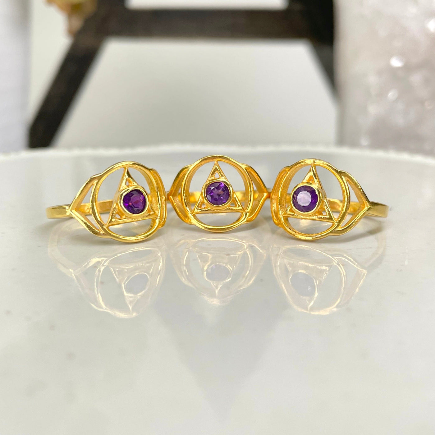 gold third eye chakra ring on display