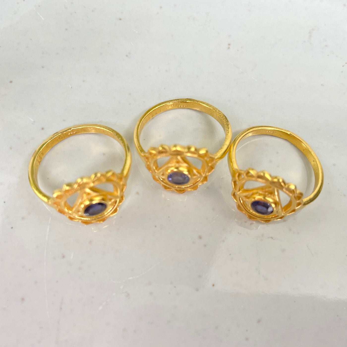 overhead view of gold throat chakra rings