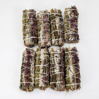 multiple sage, lavender and rosemary bundles displayed next to each other to show the slight differences in the sizes