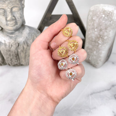 solar plexus chakra rings in hand for size reference